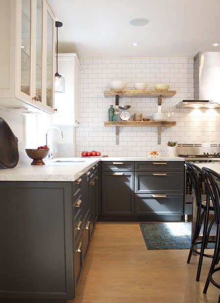 The smaller white drawers color the overall cabinetry. Trending - Dark Lower Kitchen Cabinets - The Decorologist