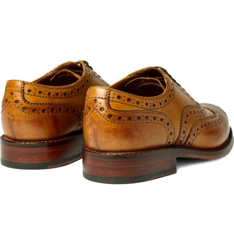 Free shipping & returns available. Foot The Coacher Stanley Leather Wingtip Brogues in Brown ...