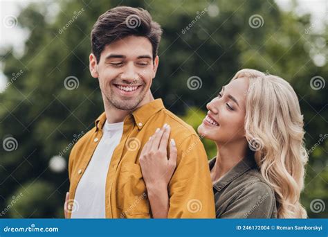 Portrait Of Attractive Tender Gentle Cheerful Amorous Couple Cuddling Enjoying Trip Outdoors