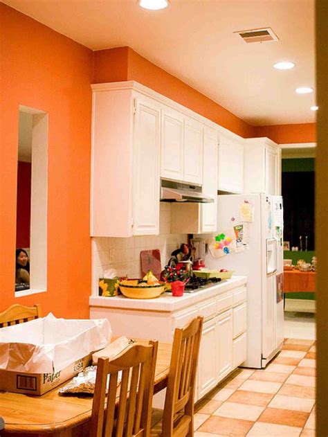 Creamy white cabinets are the hallmark of a traditional kitchen. Fresh orange kitchen interior design beautiful style ...