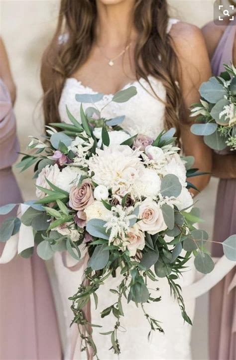 Bride in backless wedding dress with flower bouquet smiling. 40 + Mauve Wedding Color Ideas for 2020 | Colors for Wedding