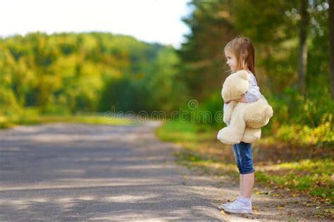 Adorable Little Girl With A Teddy Bear Stock Photo Image Of Roadside