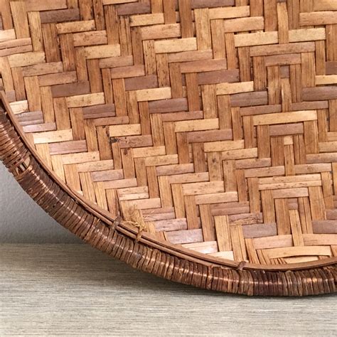 This mini version of our favorite rainbow rattan wall decor will add a unique, natural touch to a picture collage or a thoughtful statement to a nursery wall. Woven Rattan Wall Basket Round Flat Geometric Pattern ...