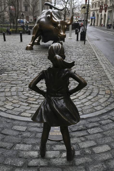 Defiant Girl Challenges Charging Bull In Ny Financial District On International Womens Day The