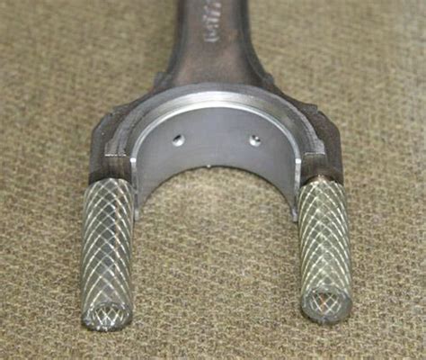 A motorcycle connecting rod is required to be hard (hrc60) at bore area, and it is required to be ductile at rod area. John_Barton-Engine_Rebuild3