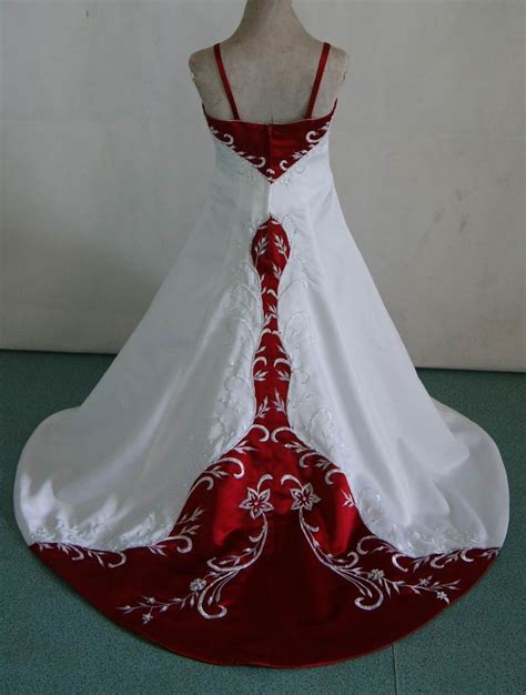 A bright red wedding gown with a polka dot bodice with cap sleeves and a rose applique skirt. Red and white baby wedding dresses