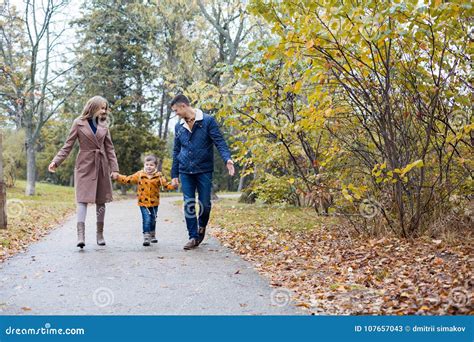 Mom Dad And A Little Boy Walk In The Park Stock Image Image Of