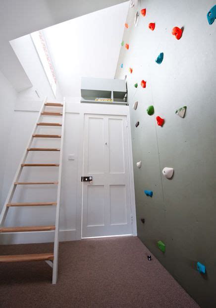 Modern house designed by naf architects features rock climbing wall that allows people to climb from one floor to the next. Modern homes featuring a rock-climbing wall