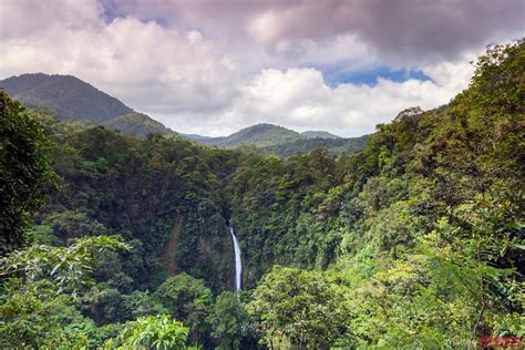 Matteo Colombo Travel Photography La Fortuna Waterfall In The Green