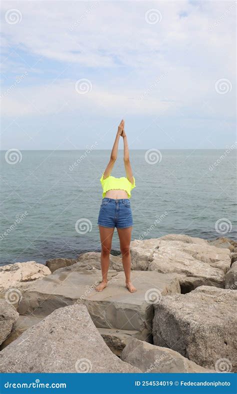 Girl In A Shirt Giving A Gymnastic Exercise Arching Her Back Bac Stock Image Image Of