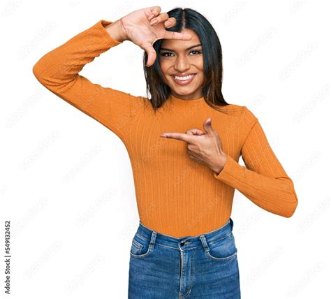 Young Latin Transsexual Transgender Woman Wearing Casual Clothes Smiling Making Frame With Hands