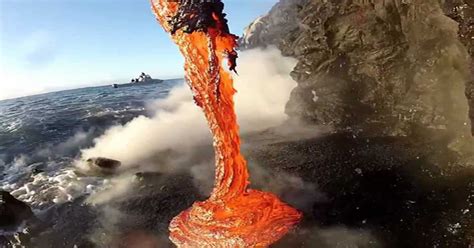 Extremely Close Up Footage Of Lava Spilling Into Water