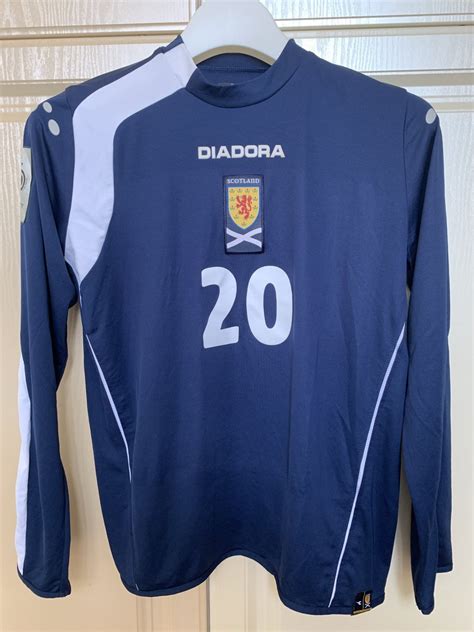 Team statistics, series, referee and starting lineups before the start. Scotland Home football shirt 2005 - 2006.