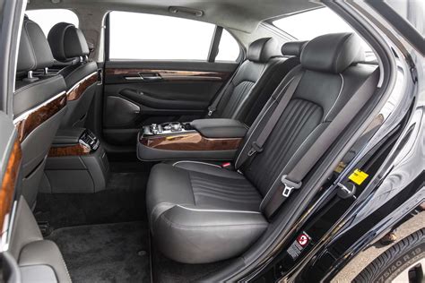 The 2017 genesis g90 is a large luxury sedan with seating for five. 2017-Genesis-G90-33T-HTRAC-Premium-rear-interior-seats ...