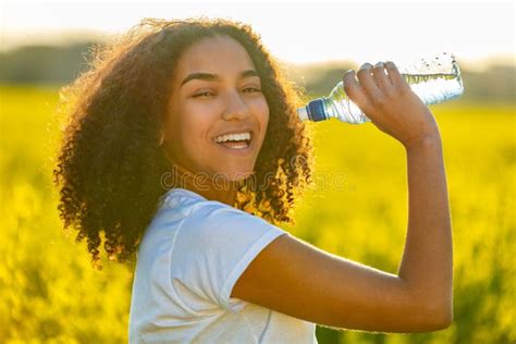 Mixed Race African American Girl Teenager Drinking Water Stock Photos