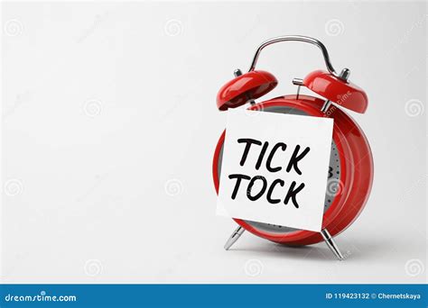 Alarm Clock and Sticky Note with Words TICK TOCK Stock Photo - Image of