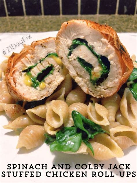 Assemble the chicken roll ups by first placing a slice of cheese on top of the chicken, then add the tomato slice and a whole basil leaf. 21 Day Fix: Spinach and Colby Jack Stuffed Chicken Roll ...