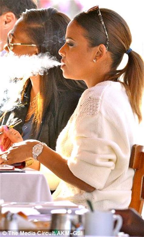 christina milian shows off shapely pins and puffs an e cigarette daily mail online