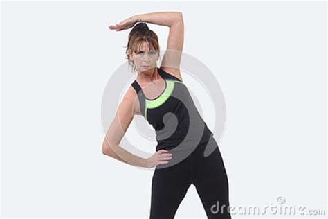 Attractive Middle Aged Woman In Sports Gear Warming Up Stock Image