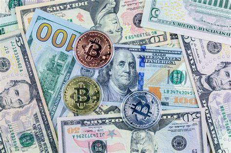 Bitcoin cash is a cryptocurrency launched in 2017 by forking the bitcoin blockchain and changed the size limit of blocks added to the blockchain. Symbol Coins Of Bitcoin On Banknotes Of US Dollars ...