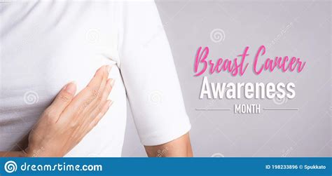 Woman Hand Checking Lumps On Her Breast For Signs Of Breast Cancer On