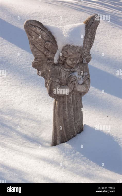 Snowy Angel Statue In The Sunlight Stock Photo Alamy