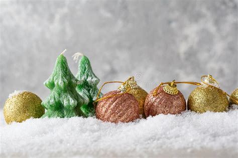 Christmas Tree Candles And Decorations On Snow Festive Concept Stock