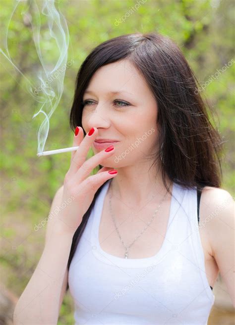 Pretty Woman Smoking — Stock Photo © Saharrr 7853475