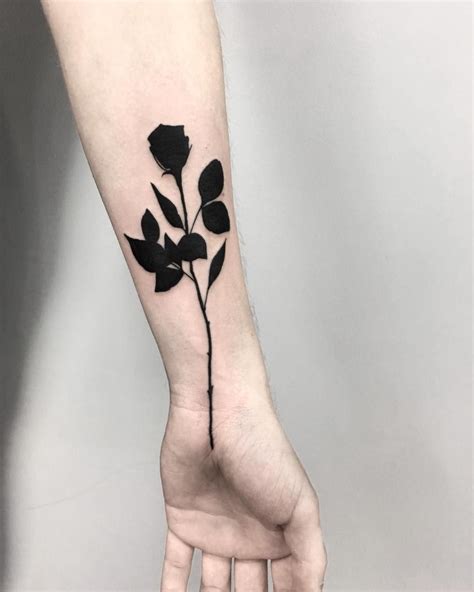 These Completely Black Tattoos Are Giving Off Major Artsy Goth Vibes