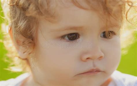 Funny Child Face Close Up Kids Baby Serious Portrait Stock Photo