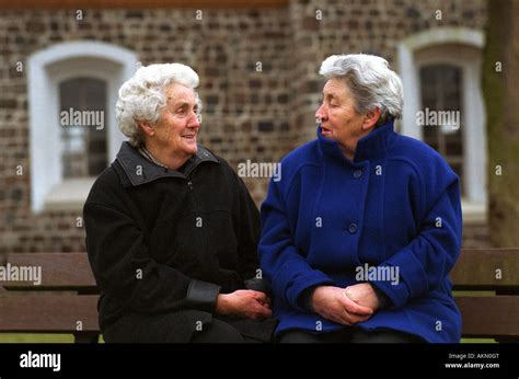 Pensioners Sitting Bench Talk Hi Res Stock Photography And Images Alamy