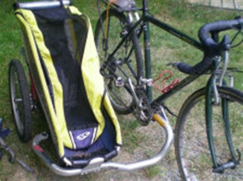 Moment when you are travelling far or even have to carry your step 6: Chariot Sidecarrier Review - Bike Trailer Review