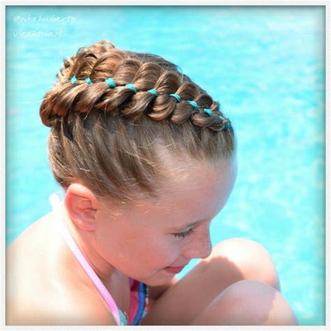The main steps for this look are to create a loose side ponytail, separate out hair for the pony wrap, make a simple thin accent braid, and actually complete a braid out of four strands (one of which is already braided). Dutch four strand braid with ribbon. | Ribbon hairstyle, Strand braid, Four strand braids