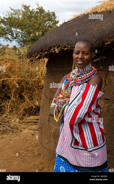 Village Scene With Masai Woman In A Masai Village Outside Amboseli