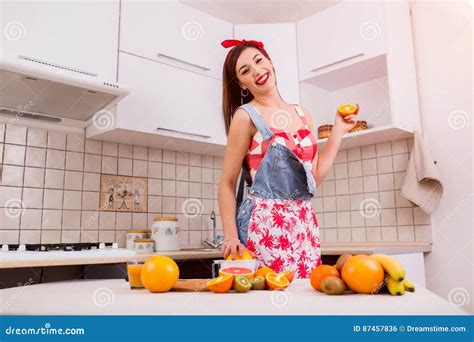 Beautiful Girl In The Kitchen Preparing Dinner Stock Photo Image Of
