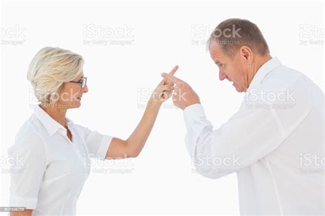 Angry Older Couple Arguing With Each Other Stock Photo Download Image