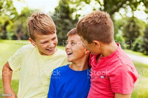 Three Happy Boys Outdoors Stock Photo Download Image Now 10 11