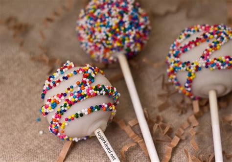 Three Cake Pops With Sprinkles On Them
