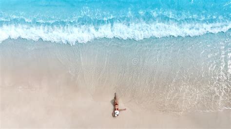 Banner Travel In Summer With Young Woman In A Red Bikini Lying On The White Sand Near The Waves