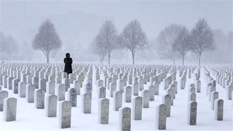 The Week In Pictures A Woman Visiting A Grave Site At Fort Snelling