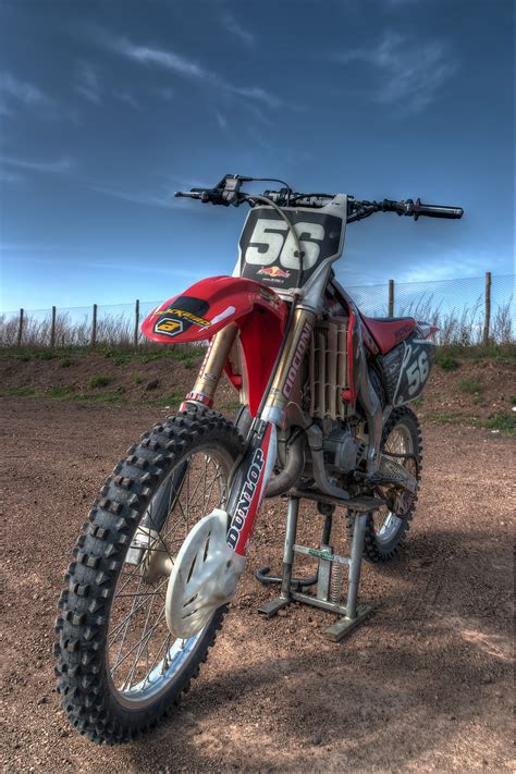 Motocross first evolved in britain from motorcycle trials competitions. honda 125 motocross | HDR creme