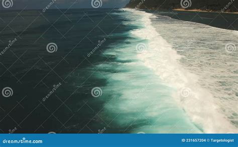 Surf The Ocean Wave Rolls Over Photo From A Height Stock Photo