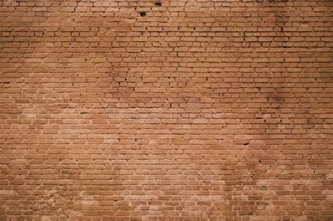The Texture Of The Brick Wall Of Many Rows Of Bricks Painted In Brown