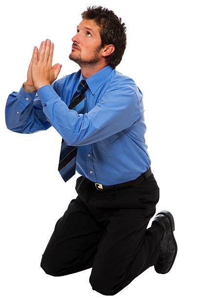 Man Praying On Knees Pictures Images And Stock Photos Istock