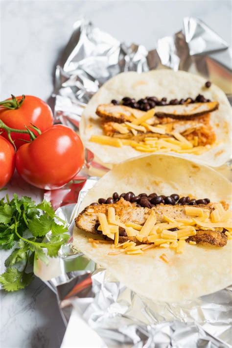 Add the chicken to the pan along with the corn, salsa, and taco seasoning. Easy Chicken Burrito Recipe | Happy Money Saver