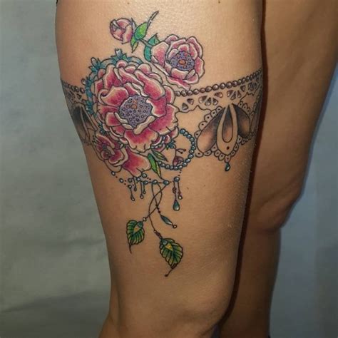 Grey flowers and gun garter tattoo 70+ Charming Garter Tattoo Designs -Keep in Touch with ...
