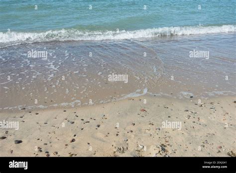 Soft Wave With White Foam Sea Surf On Sandy Beach Travel Concept Sea