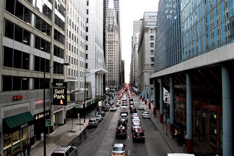 Free Stock Photo Of Street Traffic In Between City Buildings
