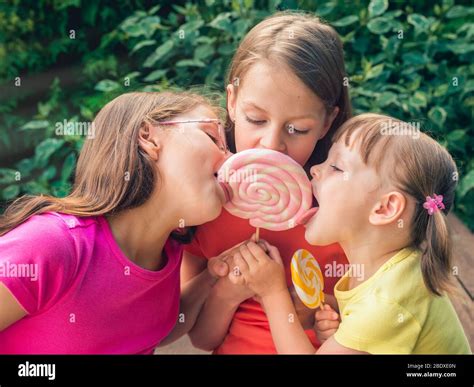 Funny Portrait Girl Licking Lollipop Fotos E Imágenes De Stock Alamy