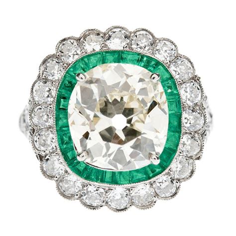 The second is a 2.5 carat emerald cut light yellow diamond in a temp setting. Cushion Cut Fancy Light Yellow Antique Diamond and Emerald ...